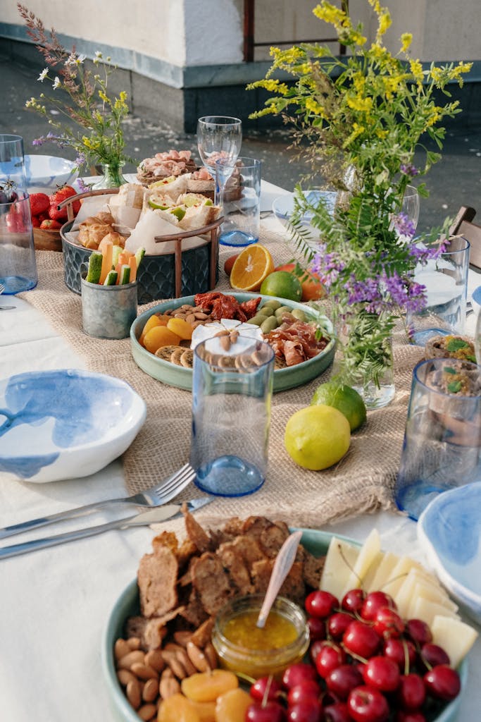 Clear Drinking Glass Beside White Ceramic Bowl With Food